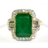 An 18ct yellow gold ring (fully hallmarked) ring set with an emerald and baguette and brilliant