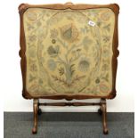 A 1930's Davrard metamorphic walnut fire screen / tea table with tapestry top under glass, H. 79cm.