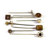 Eight antique 9ct gold diamond and stone set stick pins (approx. 12.1gr overall).