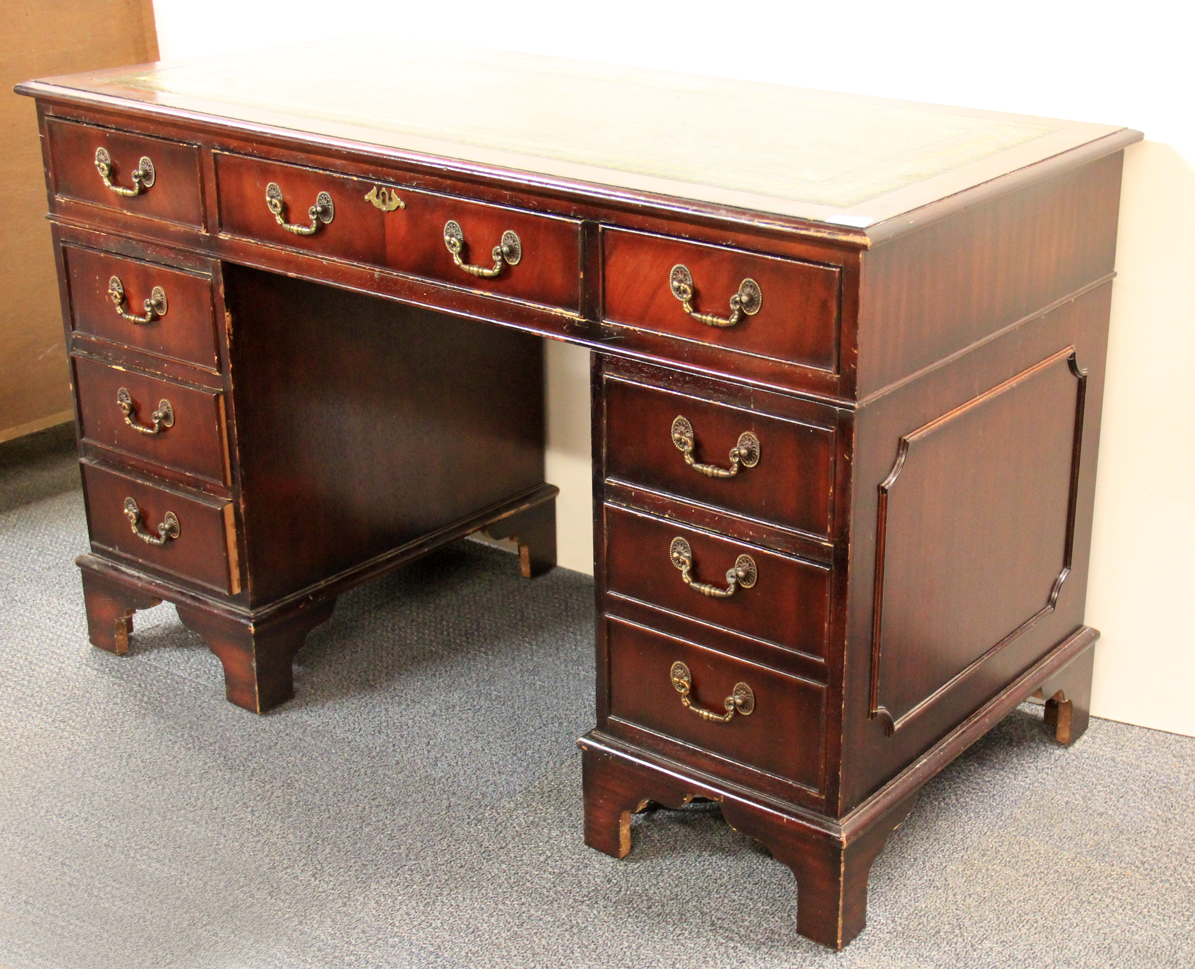 A leather top mahogany pedestal desk, W. 120cm.
