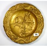 "A 19th century Japanese gilt decorated soft metal charger decorated with a Samurai fighting with