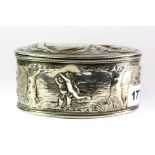 A continental oval silver box embossed with decoration of a reclining semi clad female and