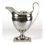 A Georgian hallmarked silver cream jug, H. 15cm.