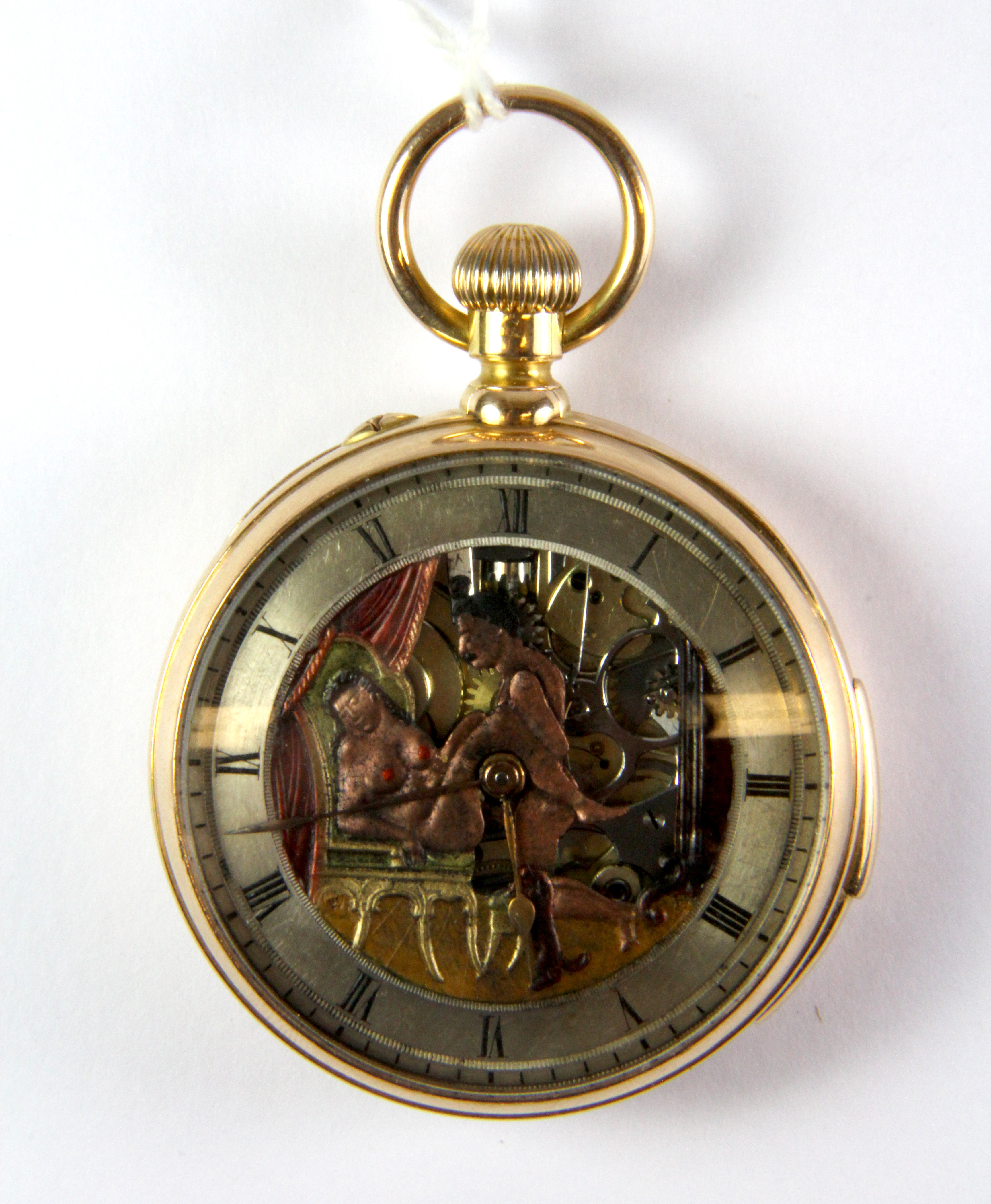 An unusual erotic action French open faced gold plated pocket watch with top wind movement.