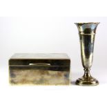 A hallmarked silver cigarette box, 9 x 11.5 x 5cm and a hallmarked silver bud vase, H. 11.5cm.