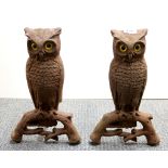 A rare pair of E. Rostand cast iron owl fire grate andirons with glass eyes, H. 38cm.