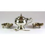 A pair of hallmarked silver shell salts, W. 5cm, and a hallmarked silver mustard pot.