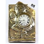 A rare hallmarked silver fronted nightstand clock featuring a relief image of a fireman, H. 16cm.