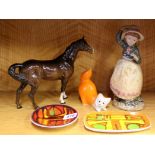 A Beswick horse, two Poole Pottery dishes and two other items.