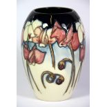 A Moorcroft tube lined vase dated 2001, H. 13cm.