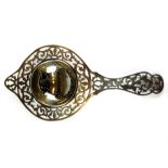 A hallmarked silver pierced tea strainer, L. 18cm.