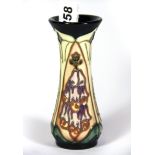 A Moorcroft tube lined vase dated "93", H. 13cm.