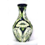 A Moorcroft tube lined vase dated 2004, H. 13.5cm.