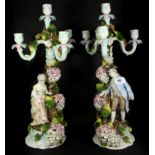 A pair of 19th century German Sitzendorf porcelain figural candelabra, H. 52cm.