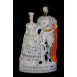 A 19th century Staffordshire flat backed figure of the King and Queen of Sardinia, H. 35cm.