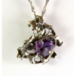 An interesting hallmarked silver pendant set with an amethyst, London, c. 1965, on a later silver