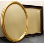 An oval gilt mirror and a black lacquered mirror, W. 78cm & 72cm.