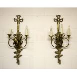 A pair of impressive three branch brass wall lights ornamented with hunting horns and oak leaves, H.