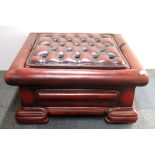 A button backed ox blood leather coffee table/stool, 73 x 73 x 35cm.