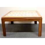 A 1970's tile topped teak coffee table, 72 x 72 x 37cm.