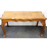 A walnut veneered coffee table, W. 89cm.