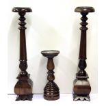 A pair of carved mahogany pedestals with a further small pedestal. H. 63cms. 33cms.