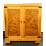 A matching burr veneered two door cabinet, W. 81cm, H. 95cm.