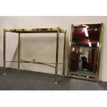 A gilt brass wall mirror and hall table, mirror 90 x 50cm, table 100 x 77cm.