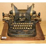 An early Oliver standard typewriter with three row keyboard.