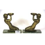 A pair of Art Deco style cold cast figural tea light holders, H. 15cms.