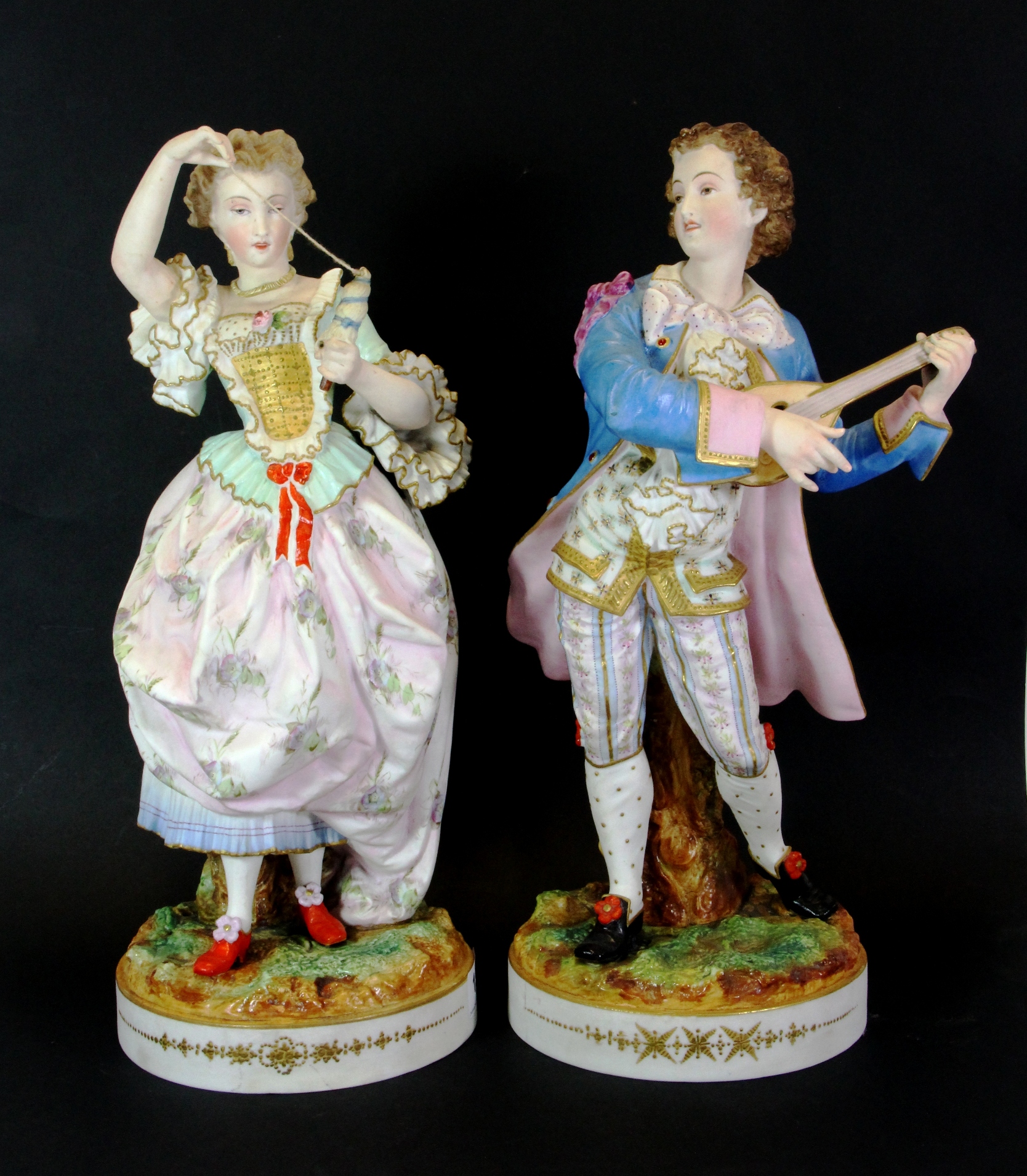 A pair of 19th century French bisque large porcelain figures, H. 41cms.