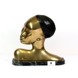 A mid 20th century bronze bust of an African woman on a green marble base, H. 25cms W, 27cms