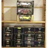 A collection of fifteen 1:18 scale Burago diecast model cars.