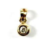 A 9ct yellow gold (stamped 9k) diamond set pendant, 1.2cm.