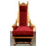 An early 20th century American Colonial carved rocking chair, H. 131cm.