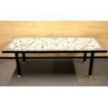 A 1960's tile topped coffee table. Size 107 x 45 x 35cms.