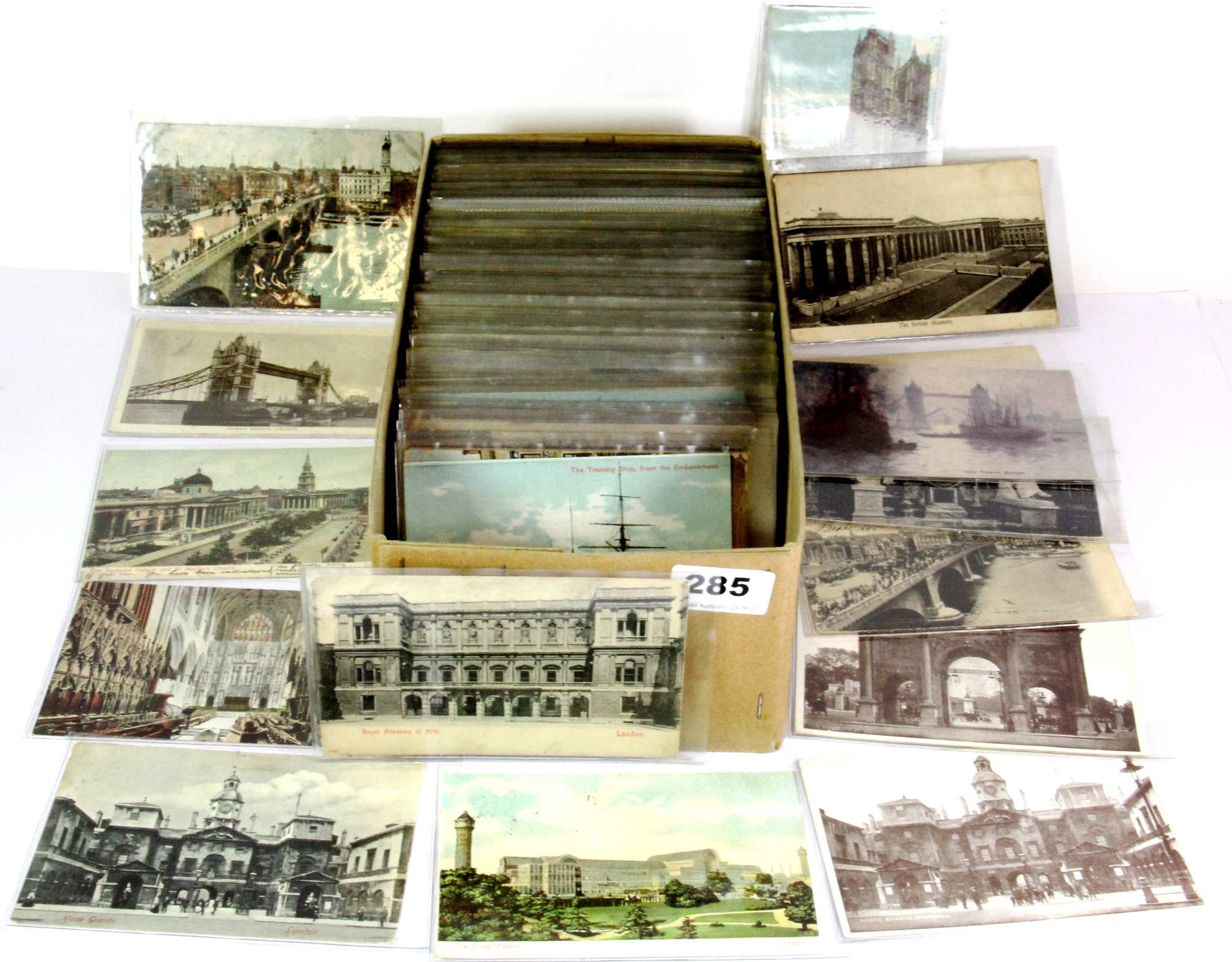 A box of mixed old postcards.
