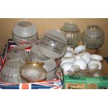 A quantity of glass oil lamp shades.