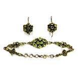 A 925 silver peridot set bracelet and pair of drop earrings.