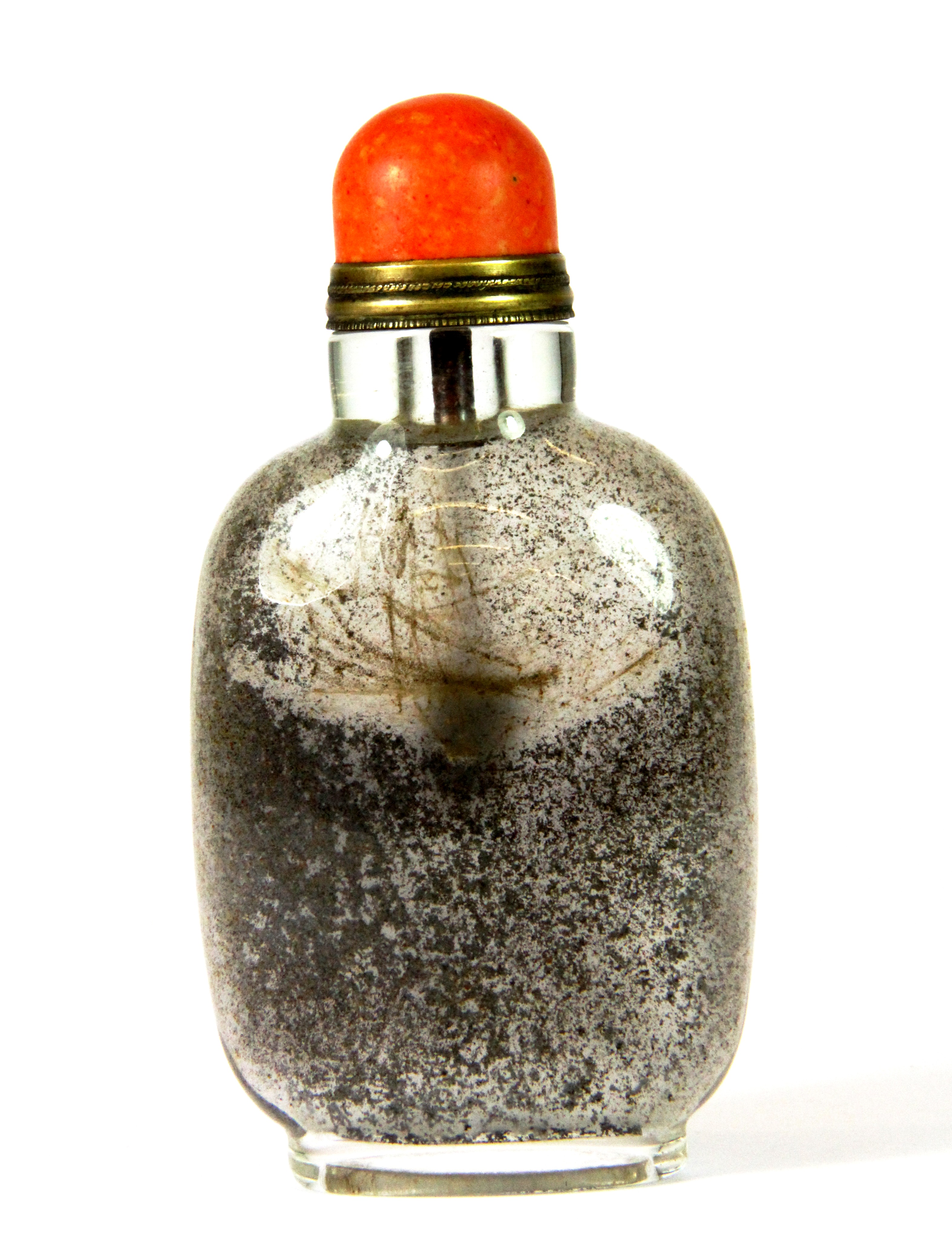 An early 20th century Chinese glass snuff bottle with gilt and coral stopper, H. 10cms.