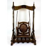 A Bavarian dolls swinging chair, H. 56cms.