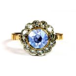 A rose metal (tested 18ct gold) sapphire and diamond cluster ring, (O.5).