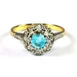 An 18ct yellow gold and platinum (stamped 18ct and plat) blue zircon and diamond cluster ring, (K.