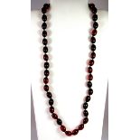 A cherry amber necklace, L . 39cm.