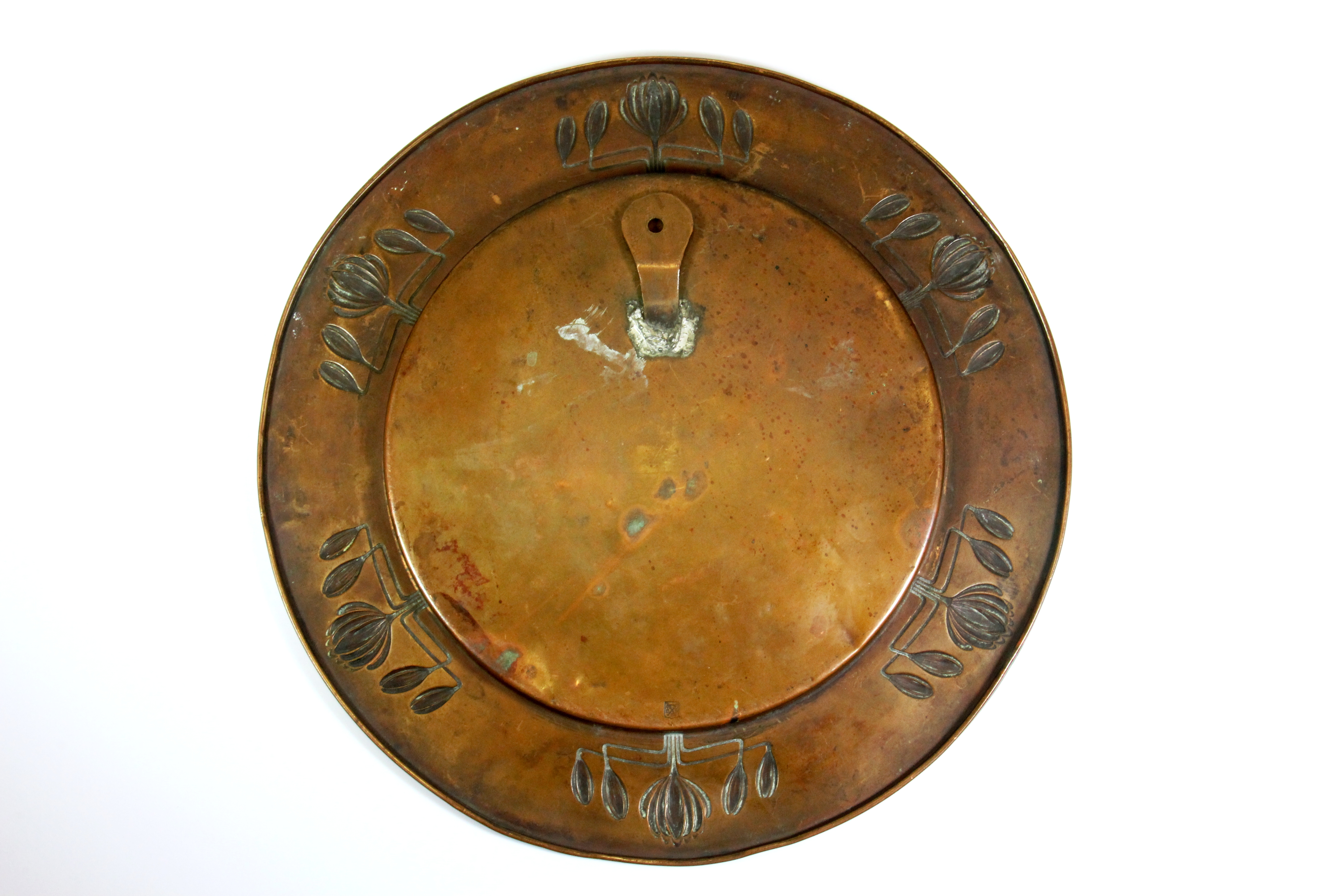 An Art Nouveau hammer copper platter stamped on the reverse for Carl Deffner, Dia. 32.5cms. - Image 2 of 2