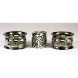 A pair of hallmarked silver Scottish thistle napkin rings, with a hallmarked silver heart shaped