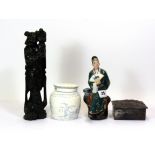 A mid 20th century Chinese porcelain figure, together with a hardwood figure, a 1920's cigarette box