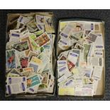 A large quantity of loose tea and cigarette cards.