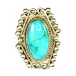 A white metal (tested silver) turquoise set ring, (O).