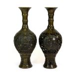Two Chinese bronze vases, one pierced, one relief decorated, H. 25cms.